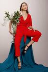 Buy_Couché By Anandini_Red Punto Plain V Neck Front Tie-up Jumpsuit _at_Aza_Fashions