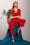Shop_Couché By Anandini_Red Punto Plain V Neck Front Tie-up Jumpsuit _at_Aza_Fashions
