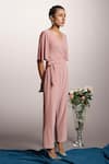 Shop_Couché By Anandini_Pink Punto Plain V Neck Front Tie-up Jumpsuit _at_Aza_Fashions