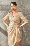 Shop_Samatvam by Anjali Bhaskar_Gold Embellishment V Neck Asymmetric Draped Dress  _Online_at_Aza_Fashions