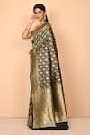 Nazaakat by Samara Singh_Black Banarasi Katan Silk Woven Floral Pattern Saree With Running Blouse_Online_at_Aza_Fashions