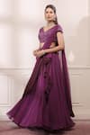 Buy_Isha Gupta Tayal_Purple Georgette Embroidered Cutdana V Neck Draped Lehenga Saree With Blouse _at_Aza_Fashions