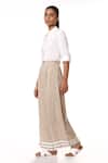 Abraham & Thakore_Beige Cellulose Blend Flared Striped Hem Pants_Online_at_Aza_Fashions