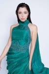 Sonaakshi Raaj_Green Silk Satin Halter Neck Draped Gown_at_Aza_Fashions