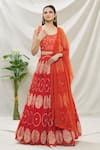 Naintara Bajaj_Orange Raw Silk Printed Bandhani Round Lehenga Set_Online_at_Aza_Fashions