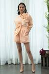 Buy_Pleats By Aruni_Orange Linen Shorts_at_Aza_Fashions