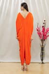 Shop_Megha Garg_Orange Crepe Embroidered Beads V Neck Draped Jumpsuit _at_Aza_Fashions