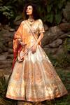 Shop_Pallavi Poddar_Ivory Dupatta Tissue, Lehenga And Blouse Raw Tirupati Embroidered Bridal Set_at_Aza_Fashions