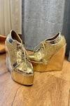 Buy_Tiesta_Gold Glitter Metallic Sneaker Wedges _at_Aza_Fashions
