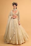 Buy_Neha Khullar_Ivory Banarasi Organza Woven Floral Motifs Plunge V Neck Tiered Lehenga Set _at_Aza_Fashions