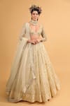 Neha Khullar_Ivory Banarasi Organza Woven Floral Motifs Plunge V Neck Tiered Lehenga Set _Online_at_Aza_Fashions