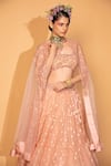 Neha Khullar_Peach Banarasi Organza Woven Floral Tiered Lehenga Set With Embroidered Cape _Online_at_Aza_Fashions