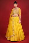 Buy_Neha Khullar_Yellow Banarasi Chanderi Woven Mirror Sweetheart Neck Tiered Lehenga Set _at_Aza_Fashions