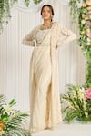 Buy_Nidhika Shekhar_Ivory Foil Georgette Embroidery Pearl Blouse Scoop Subh Bela Cape Saree Set _at_Aza_Fashions