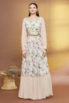 Samyukta Singhania_Peach Georgette, Net Embroidery, Sequins V-neck Floral Print Tiered Lehenga Set _Online_at_Aza_Fashions