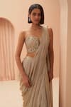 Shop_PARUL GANDHI_Gold Lycra Embellished Sequin Pleated Pre-draped Saree With Corset _at_Aza_Fashions