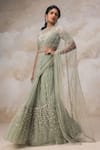 Buy_COUTURE BY NIHARIKA_Green Net Embroidery Bugle Beads Round Lehenga Saree With Blouse  _at_Aza_Fashions