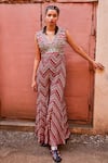 Buy_SVA by Sonam & Paras Modi_Multi Color Shimmer Crepe Printed Stripe V Neck Bohemian Bell Bottom Jumpsuit_at_Aza_Fashions