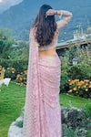 Shop_ANJALEE AND ARJUN KAPOOR_Pink Net Embroidered Floral U Neck Pre-draped Saree With Blouse  _at_Aza_Fashions