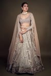 Shop_ANJALEE AND ARJUN KAPOOR_Pink Net Embroidered Applique V Neck Bridal Lehenga Set  _at_Aza_Fashions