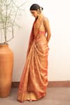 Priyanka Raajiv_Orange Silk Chanderi Woven Floral Quatrefoil Zahal Saree With Running Blouse_at_Aza_Fashions