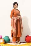 Buy Mithi Supari Orange Tissue, Silk Embroidery, Sequins, Mirrors V-neck Kesar Kurta Pant Set at Aza Fashions Buy_Mithi Supari_Orange Tissue, Silk Embroidery, Sequins, Mirrors V-neck Kesar Kurta Pant Set _at_Aza_Fashions