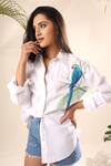 Kyra By Nina + Deepika White Cotton Collared The Mighty Macaw Bird Hand Painted Shirt Online at Aza Fashions Kyra By Nina + Deepika_White Cotton Collared The Mighty Macaw Bird Hand Painted Shirt _Online_at_Aza_Fashions