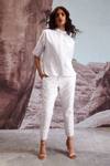 Dash And Dot_Ivory Polyester, Viscose, Spandex Embroidery Floral Tapered Pants_at_Aza_Fashions