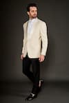 Buy_ARJUUN KILACHAND_Ivory Wool Silk Textured Geometric Shawl Lapel Collar Tuxedo And Trouser Set _at_Aza_Fashions