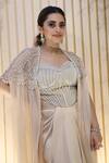 Divya Aggarwal_Beige Cape Crushed Organza, Corset And Skirt Hayden Embellished & Draped Set_at_Aza_Fashions