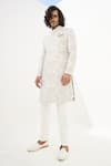 Buy Arjan Dugal Ivory Chanderi Silk Embroidered Thread And Zari Work Achkan Set at Aza Fashions Buy_Arjan Dugal_Ivory Chanderi Silk Embroidered Thread And Zari Work Achkan Set _at_Aza_Fashions