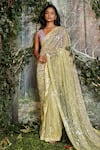 Buy_Kashmiraa_Yellow Net Hand Embroidered Cutdana Blunt V Neck Saree With Blouse _at_Aza_Fashions