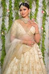 Buy_Sanjana Thakur_Ivory Blouse And Lehenga Pure Raw Silk Hand Embroidery Floral Deep V Bridal Set _Online_at_Aza_Fashions