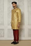 Aryavir Malhotra_Gold Sherwani Jamewar Woven Brocade Floral Pattern With Churidar _at_Aza_Fashions