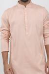 Shop_Krishna Mehta_Peach Cotton, Viscose Mandarin Collar Textured Kurta Set _at_Aza_Fashions