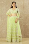 Buy_Keerthi Kadire_Green Net Hand Embroidered Pearl Deep U Neck Blouse Bridal Lehenga Set _at_Aza_Fashions