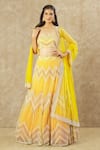 Buy_Keerthi Kadire_Yellow Net Hand Embroidered Pearl Sweetheart Neck Blouse Bridal Lehenga Set _at_Aza_Fashions