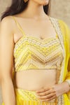 Buy_Keerthi Kadire_Yellow Net Hand Embroidered Pearl Sweetheart Neck Blouse Bridal Lehenga Set _Online_at_Aza_Fashions