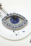 Shop Ozel Silver Embellished Evil Eye Rhinestone Studded Clutch at Aza Fashions Shop_Ozel_Silver Embellished Evil Eye Rhinestone Studded Clutch_at_Aza_Fashions