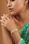 Buy_Curio Cottage_Gold Plated Kundan And Pearls & Studded Ponchi Bracelet_at_Aza_Fashions