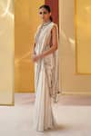 Priyanka Singh_Ivory Net Embroidery Zardozi Deep V Neck Pre-draped Saree With Top  _Online_at_Aza_Fashions