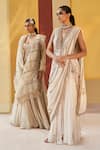 Priyanka Singh_Ivory Net Embroidery Zardozi Deep V Neck Pre-draped Saree With Top  _at_Aza_Fashions