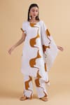 Shop_Kanelle_Ivory Cotton Slub Satin Printed Cosmic Asymmetric Draped Tunic And Pant Set _Online_at_Aza_Fashions