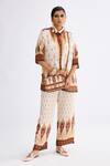 Rajdeep Ranawat_Brown Satin Printed Abstract Permaz Pattern Pant  _at_Aza_Fashions