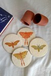 Buy_ARANYA EARTHCRAFT_Multi Color Papier Mache Hawk And Luna Carved Coasters Set_at_Aza_Fashions