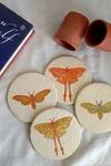 ARANYA EARTHCRAFT_Multi Color Papier Mache Hawk And Luna Carved Coasters Set_at_Aza_Fashions