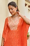 Palak & Mehak_Orange Rayon Crepe Lurex Stripe V Mira Pattern Kaftan With Sharara _at_Aza_Fashions
