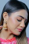 Buy_Namasya_Gold Plated Kundan Carved Jhumkas _at_Aza_Fashions