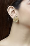 Buy_Mira by Radhika Jain_Gold Plated Carved Earrings _at_Aza_Fashions