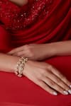 Buy_Paisley Pop_Gold Plated Kundan Pearl Embellished Bracelet _at_Aza_Fashions